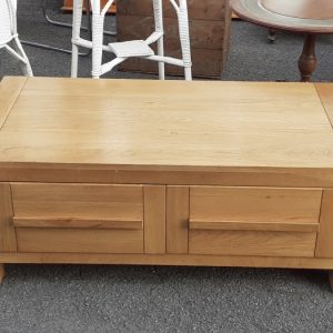 light oak coffee table with drawers.