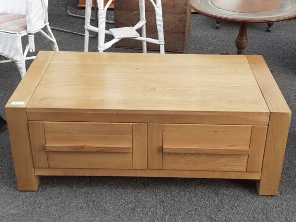 light oak coffee table with drawers.